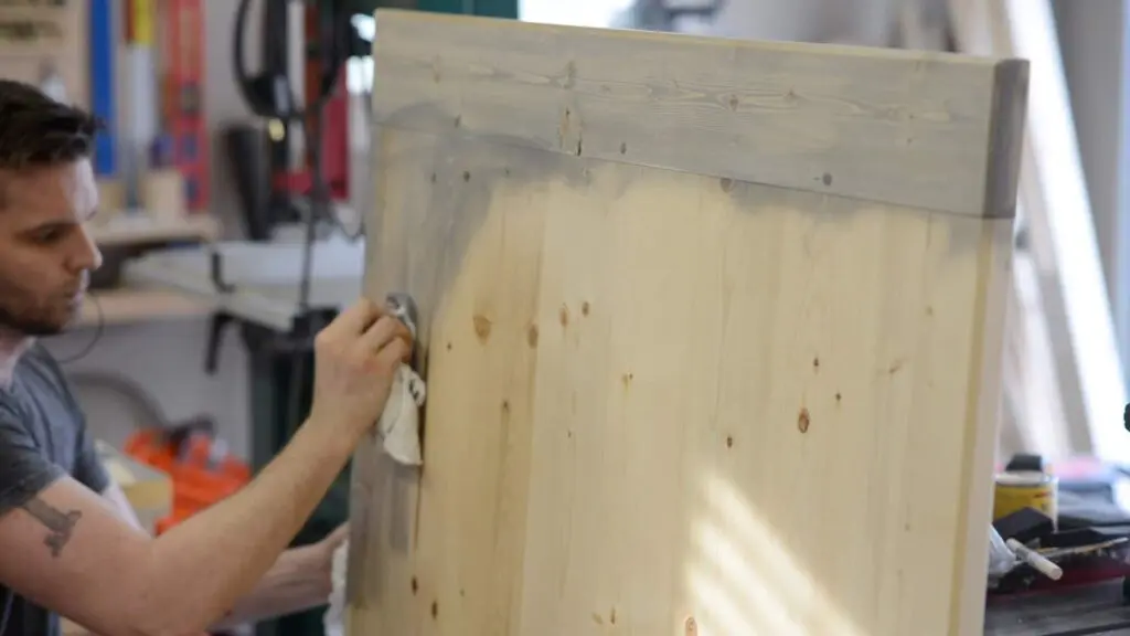 applying stain to coffee table top