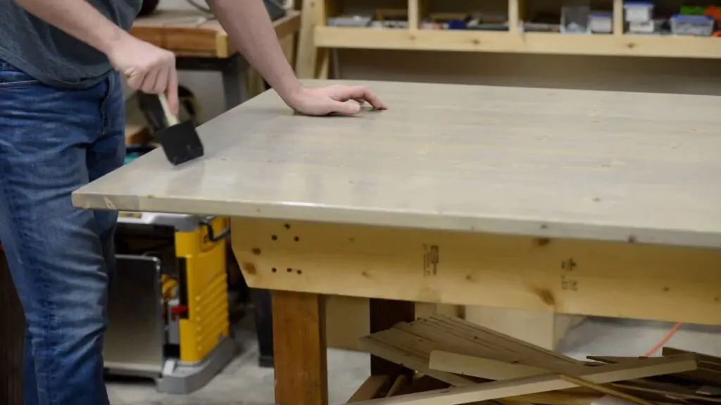 applying finish to a coffee table