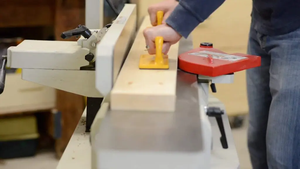 flattening wood on the jointer